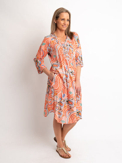 Knee-length Pleated Dress with Subtle Frills and 3/4 Raglan Sleeve in Orange Geo